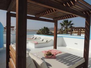 The swimming pool at or close to COZY, Beach House , by MAHBOVILLAS