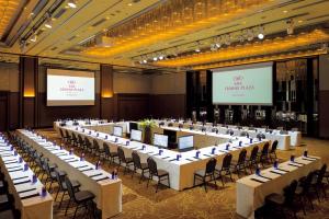 a large banquet hall with white tables and chairs at ANA Crowne Plaza Kanazawa by IHG in Kanazawa
