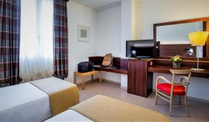 TV a/nebo společenská místnost v ubytování Delfina Palace Hotel