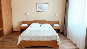 Кровать или кровати в номере Отель Конаково