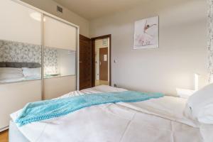 Posteľ alebo postele v izbe v ubytovaní Apartamenty Almar Diune