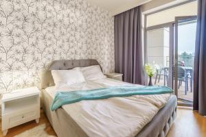 Posteľ alebo postele v izbe v ubytovaní Apartamenty Almar Diune