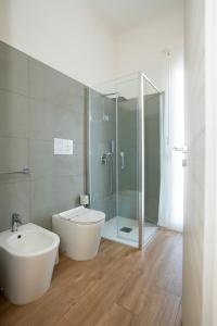 a bathroom with a tub and a sink and a shower at Romeo&giuliet in Marsala