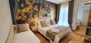 Ένα ή περισσότερα κρεβάτια σε δωμάτιο στο Amsterdam Suite Hotel & SPA