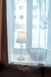 a lamp sitting on a table next to a window at Маяковский Бульвар рядом с Ретро поездом in Sortavala