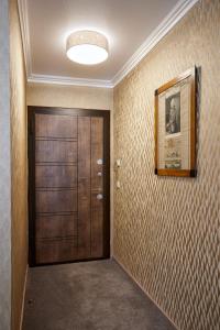 a hallway with a door and a picture on the wall at Atlas Posthotel in Garmisch-Partenkirchen