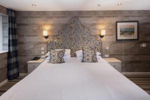 Säng eller sängar i ett rum på Hotel Hebrides