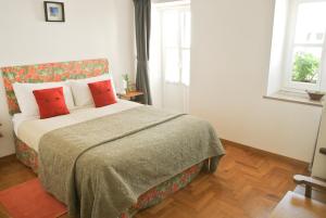 Cama ou camas em um quarto em Calcada Guesthouse