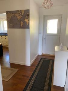 a room with a wall with a map of the world at Orchard Cottage in Tiverton +24 photos