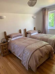 Cama o camas de una habitación en Orchard Cottage