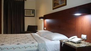 Rúm í herbergi á Hotel Castilla