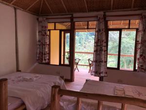 Ein Bett oder Betten in einem Zimmer der Unterkunft Nshongi Camp
