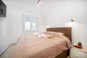 Postel nebo postele na pokoji v ubytování Luxury and modern apartment on the main beach + 6 fotografií