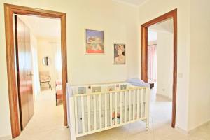 A bed or beds in a room at Acharavi Beach Villa by PosarelliVillas