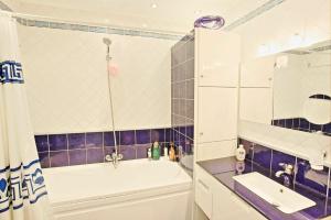A bathroom at Acharavi Beach Villa by PosarelliVillas