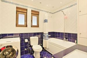 A bathroom at Acharavi Beach Villa by PosarelliVillas