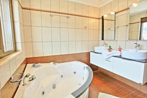 A bathroom at Acharavi Beach Villa by PosarelliVillas