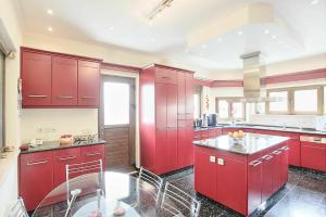 A kitchen or kitchenette at Acharavi Beach Villa by PosarelliVillas
