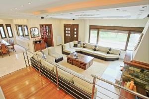 A seating area at Acharavi Beach Villa by PosarelliVillas