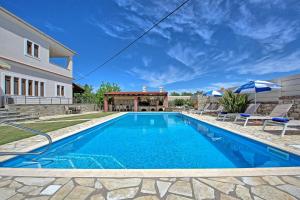 The swimming pool at or close to Acharavi Beach Villa by PosarelliVillas