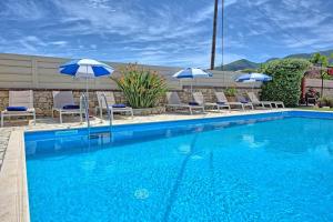 The swimming pool at or close to Acharavi Beach Villa by PosarelliVillas