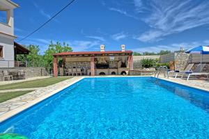 The swimming pool at or close to Acharavi Beach Villa by PosarelliVillas