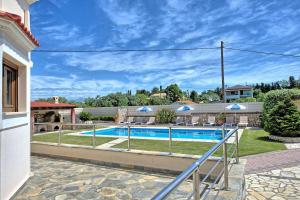 The swimming pool at or close to Acharavi Beach Villa by PosarelliVillas