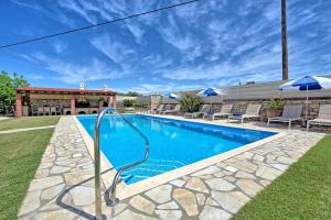 The swimming pool at or close to Acharavi Beach Villa by PosarelliVillas