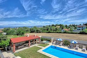 The swimming pool at or close to Acharavi Beach Villa by PosarelliVillas