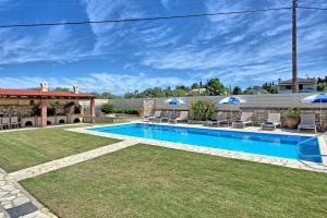 The swimming pool at or close to Acharavi Beach Villa by PosarelliVillas