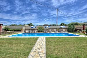 The swimming pool at or close to Acharavi Beach Villa by PosarelliVillas