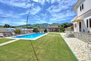 The swimming pool at or close to Acharavi Beach Villa by PosarelliVillas