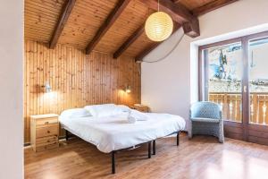 מיטה או מיטות בחדר ב-The Lodge Monte Bondone