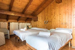 Postel nebo postele na pokoji v ubytování The Lodge Monte Bondone
