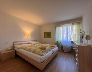 Ένα ή περισσότερα κρεβάτια σε δωμάτιο στο Brissago: Casa Collinetta H +11 φωτογραφίες