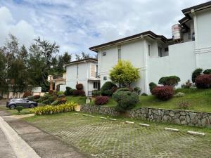 a house with a stone path in front of it at Tagaytay Hampton Villa in Tagaytay