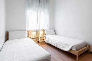 Posteľ alebo postele v izbe v ubytovaní Happy & Beautiful Flat in Central Milan