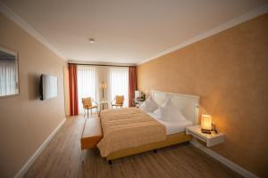 Postel nebo postele na pokoji v ubytování Hotel & Restaurant Alte Schule