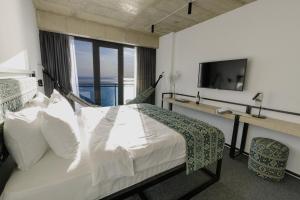 Postel nebo postele na pokoji v ubytování Kartuli Hotel