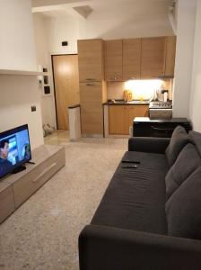 a living room with a couch and a tv at Roma - Talenti in Rome