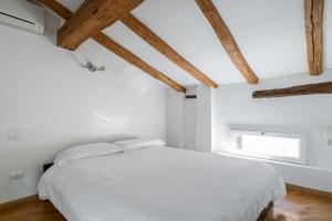 Postel nebo postele na pokoji v ubytování Appartamento Guerrazzi vicino a Palazzo Garganelli