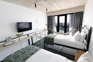 Postel nebo postele na pokoji v ubytování Kartuli Hotel