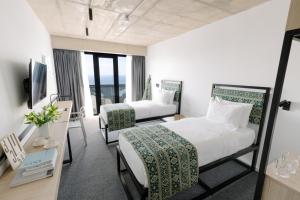Postel nebo postele na pokoji v ubytování Kartuli Hotel