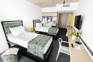 Postel nebo postele na pokoji v ubytování Kartuli Hotel