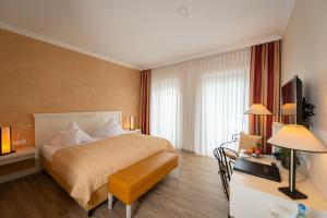 Postel nebo postele na pokoji v ubytování Hotel & Restaurant Alte Schule