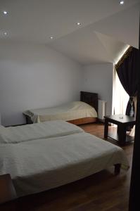 Postel nebo postele na pokoji v ubytování Hotel Bagineti