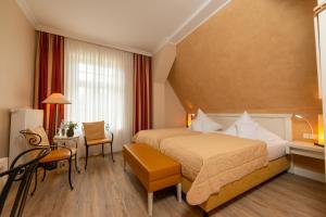 Postel nebo postele na pokoji v ubytování Hotel & Restaurant Alte Schule