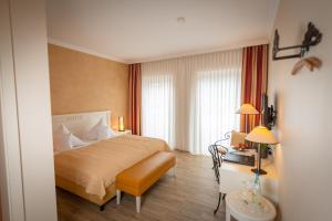 Postel nebo postele na pokoji v ubytování Hotel & Restaurant Alte Schule