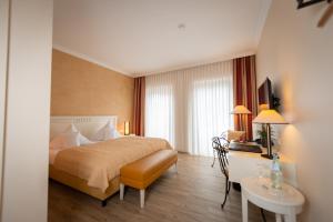 Postel nebo postele na pokoji v ubytování Hotel & Restaurant Alte Schule