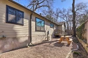 a house with a picnic table in front of it at Eclectic Austin Bungalow Central Location! in Austin